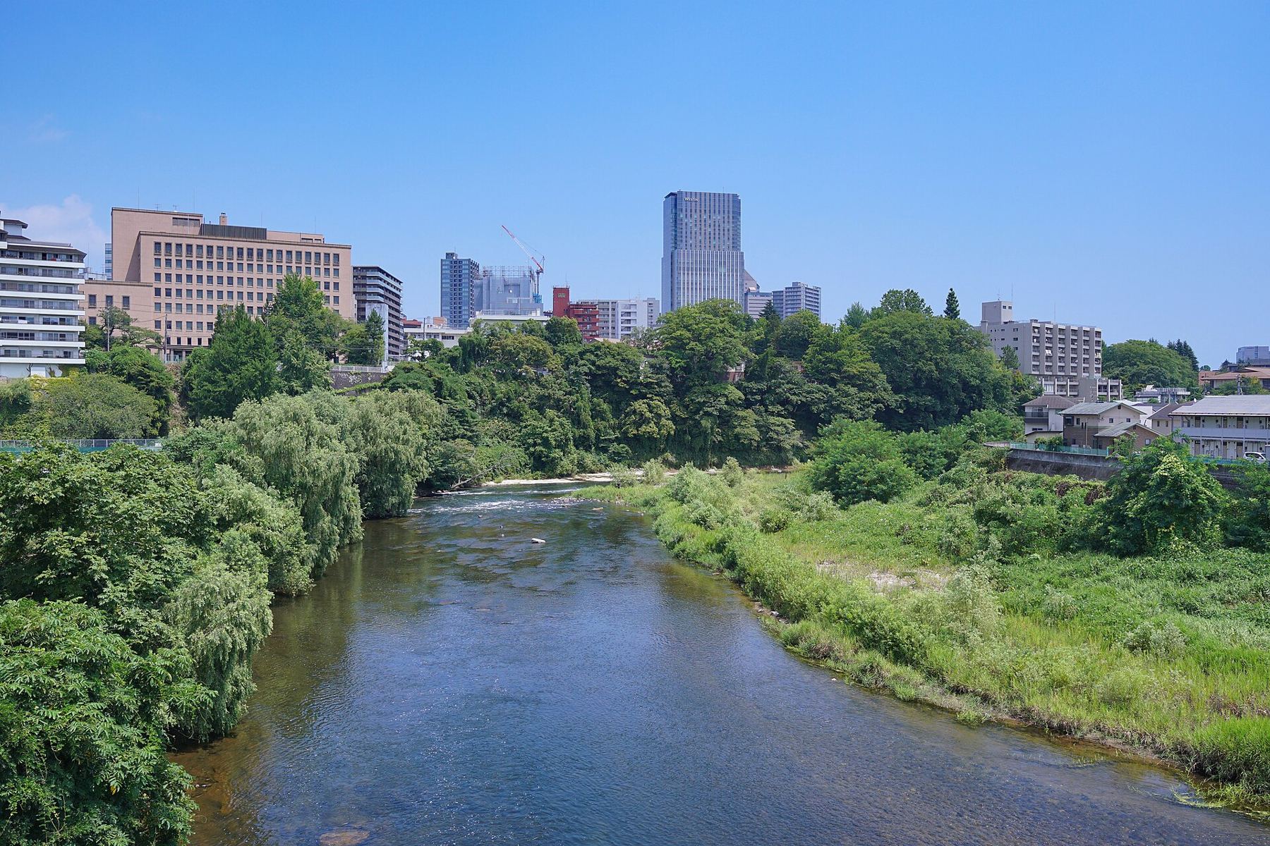 Sendai skyline and Hirose River from Hyojogawara Bridge.jpg